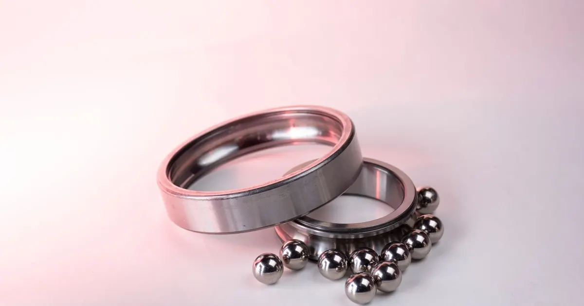 Bearing outer ring, inner ring and steel balls laid out, the parts that set the bearing bore tolerance in automotive housings